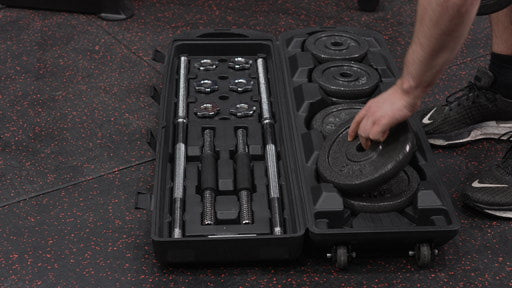 An image of the cast iron adjustable dumbbell and barbell set to illustrate the Exersci blog post entitled "What essentials should a beginner home gym have?"