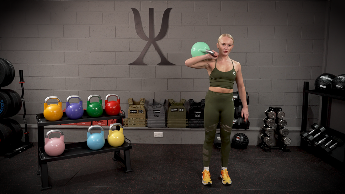 An image of a woman exercising with the Exersci competition kettlebells to illustrate the Exersci blog post entitled "10 beginner exercises for your new kettlebell set"