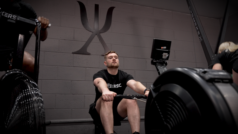 Image of a group of people completing cardio on a range of Exersci endurance machines to illustrate the Exersci blog post entitled 'A Tour of the Gym Equipment in a Well-Stocked Gym'