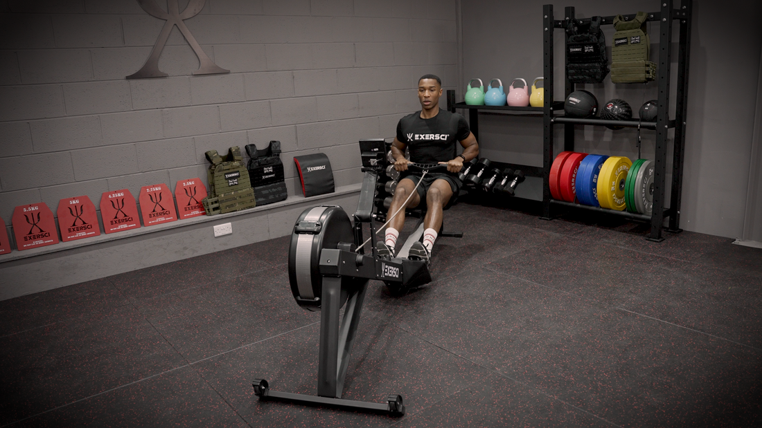 Image of a man on a rowing machine in an Exersci branded gym to illustrate the Exersci blog entitled 'Home Gym Vs Gym Membership: Which One Reigns Supreme?'