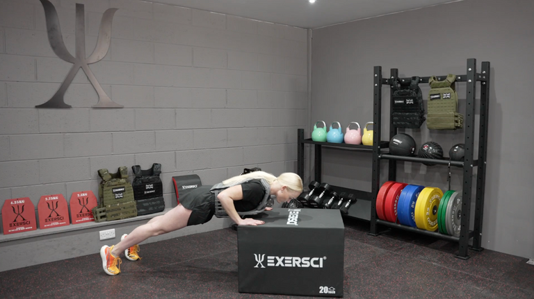 An image of a woman performing press ups with an Exersci weighted vest on to illustrate the Exersci blog post entitled 'Are Weighted Vests Good For Building Muscle?'