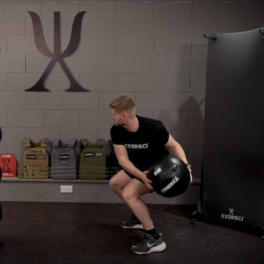 An image of a man throwing an Exersci wall ball against the wall. This image is to illustrate the Exersci blog post entitled 'Medicine Balls vs Wall Balls: Which Should You Use?''