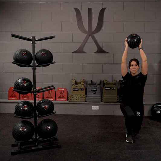 A man completing a pull up with a weighted vest on  in front of an Exersci banner to illustrate the blog entitled 'The Complete Guide To Cutting - How To Loose Fat And Maintain Muscle'