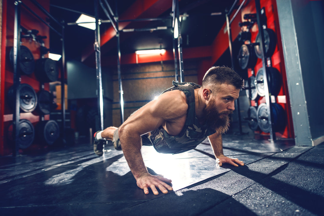 An image of a man performing press-ups with a weighted vest to illustrate the Exersci blog post entitled  'The Science of Load: Why Weighted Vests Improve Strength & Daily Function'