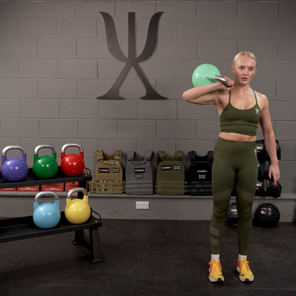 Image of gym member using competition kettlebells in gym